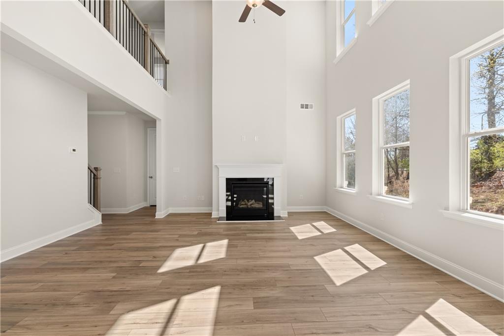 900 Melody Ridge Lane Buford, GA 30518 - Photo 10 of 30 a view of an empty room with window and fire place