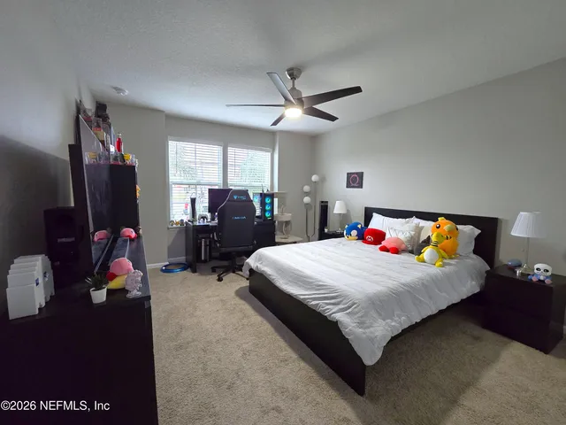 a work room with furniture and a potted plant
