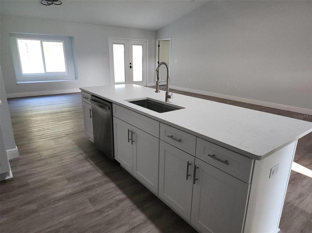1111 Dagmar Avenue Spring Hill, FL 34606 - Photo 10 of 27 a hallway with sink and mirror