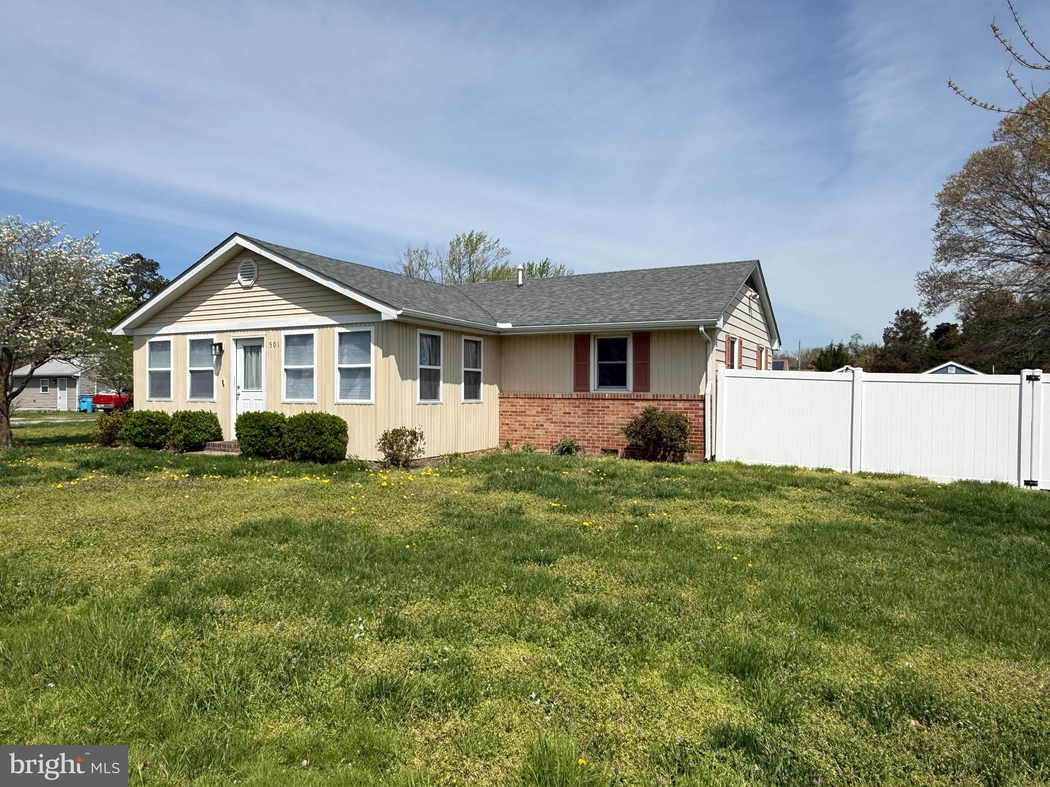 501 Chestnut Street Hebron, MD 21830 - Photo 4 of 30 a front view of a house with a yard