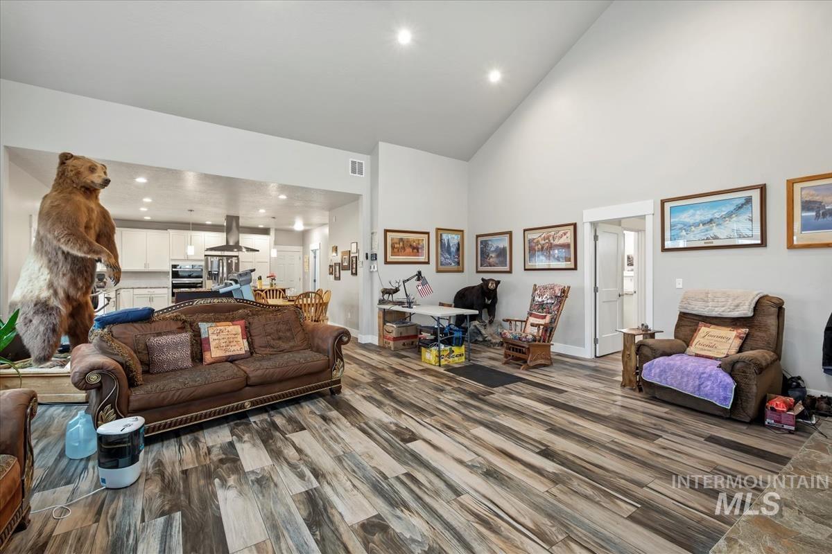 17322 Can-Ada Road Nampa, ID 83687 - Photo 13 of 44 Living area featuring high vaulted ceiling, recessed lighting, and dark wood finished floors