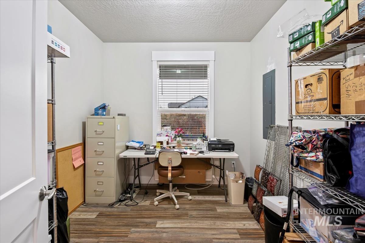 17322 Can-Ada Road Nampa, ID 83687 - Photo 16 of 44 Office featuring light wood-type flooring, a textured ceiling, and electric panel