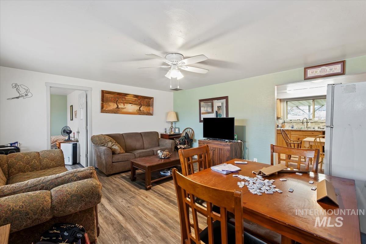 17322 Can-Ada Road Nampa, ID 83687 - Photo 23 of 44 Living area with a ceiling fan and wood finished floors