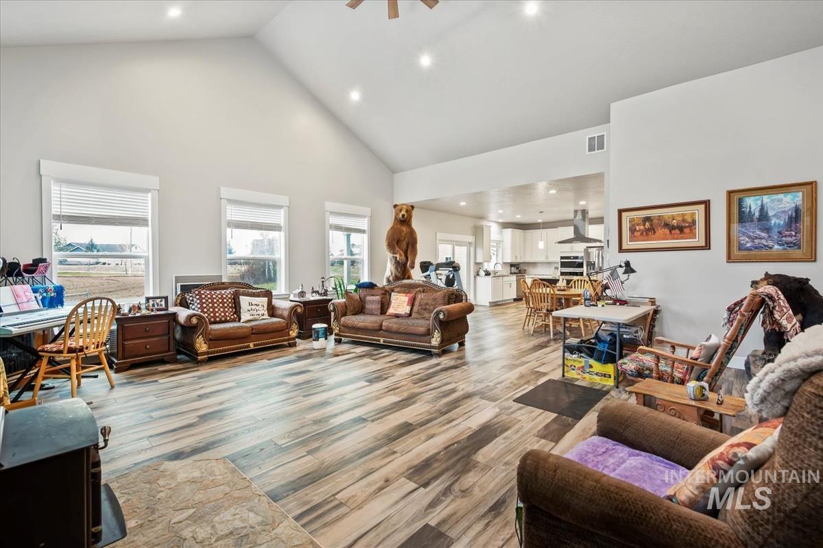 17322 Can-Ada Road Nampa, ID 83687 - Photo 32 of 44 Living room featuring high vaulted ceiling, recessed lighting, wood finished floors, and ceiling fan