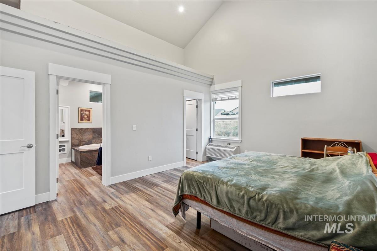 17322 Can-Ada Road Nampa, ID 83687 - Photo 5 of 44 Bedroom with wood finished floors and high vaulted ceiling