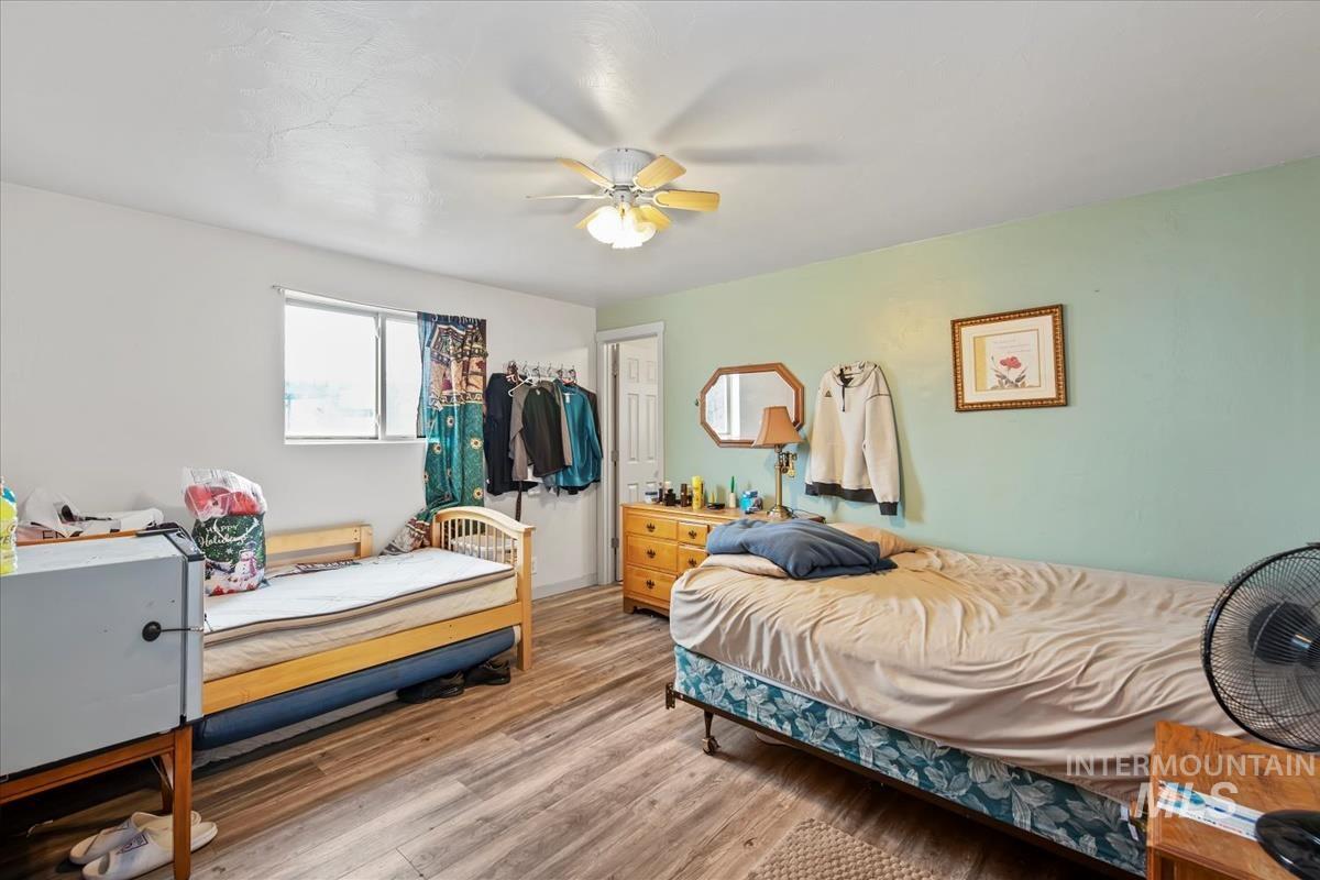 17322 Can-Ada Road Nampa, ID 83687 - Photo 9 of 44 Bedroom with wood finished floors and ceiling fan