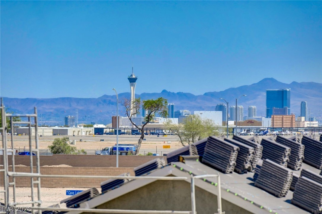 3318 North Decatur Boulevard, Unit 2072 Las Vegas, NV 89130 - Photo 33 of 50 A striking desert vista with distant city views and majestic mountains under a clear sky.