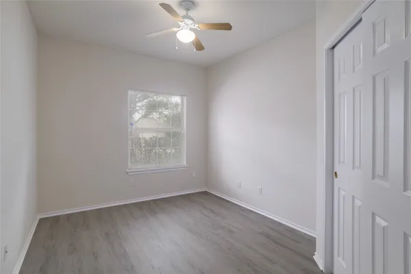 a bathroom with a bathtub shower sink vanity and toilet