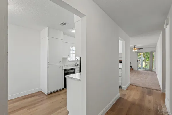 a view of a kitchen from the hallway