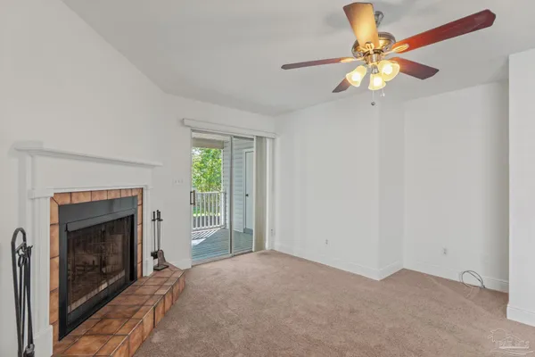 a view of empty room with fireplace