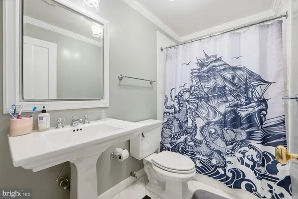 a bedroom with bed and window