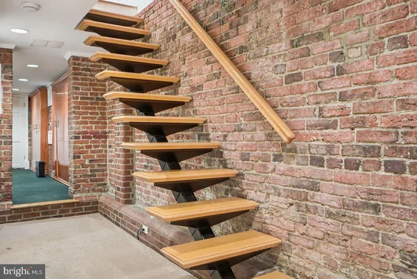 an empty room with furniture and a flat screen tv