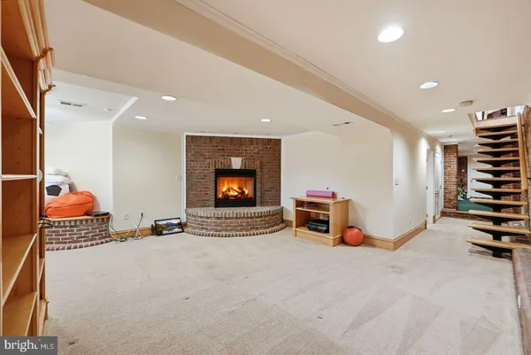 a view of a livingroom with furniture and a flat screen tv
