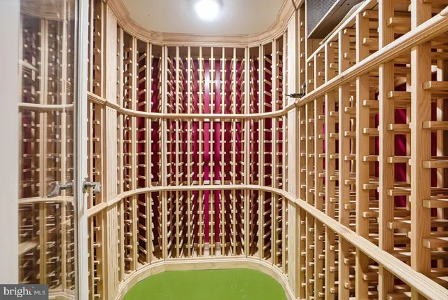 a view of a hallway with wooden shelves