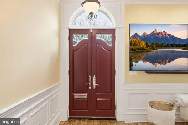 a lobby with furniture and wooden floor