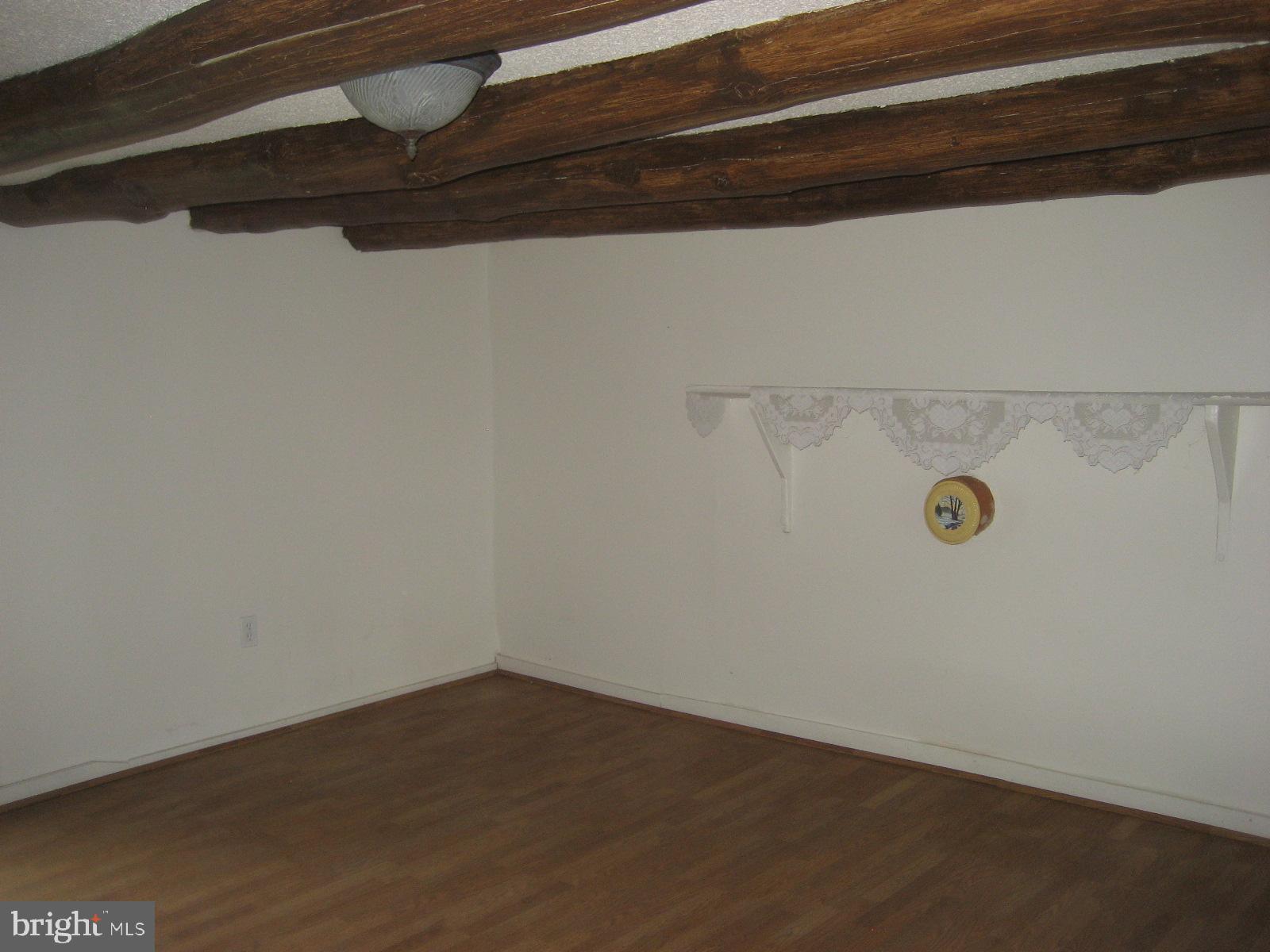 5856 Moore Road Marshall, VA 20115 - Photo 21 of 62 living room with log ceiling beams