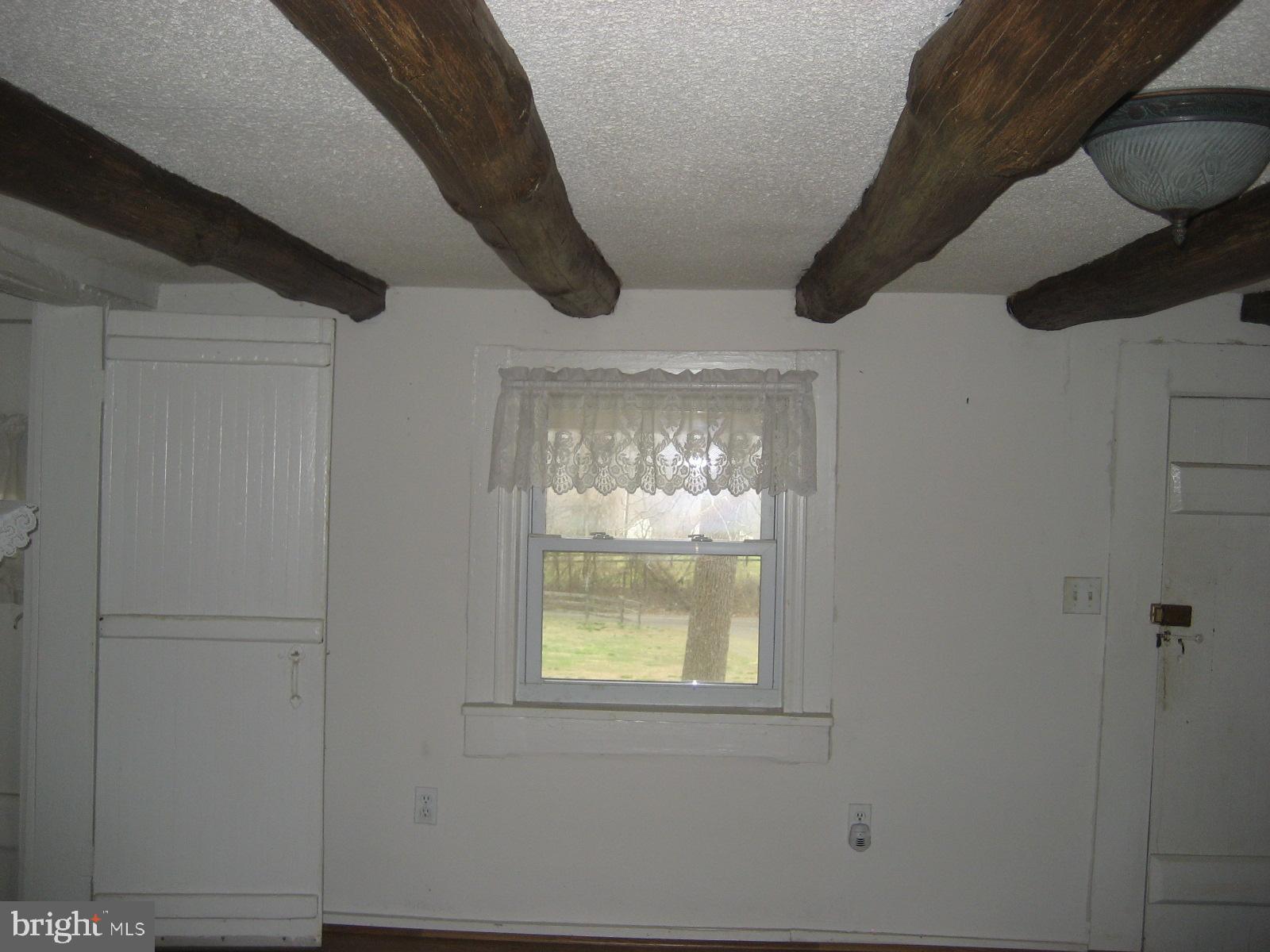 5856 Moore Road Marshall, VA 20115 - Photo 22 of 62 log beams in ceiling