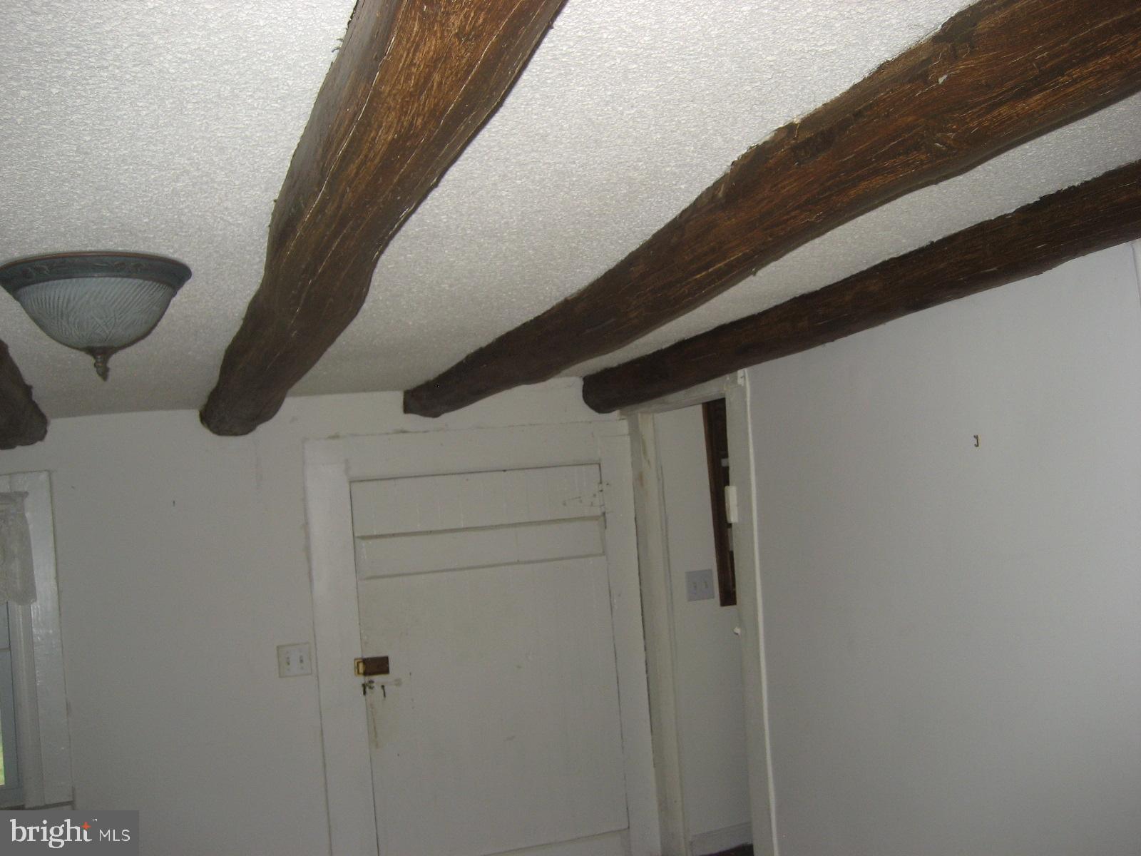 5856 Moore Road Marshall, VA 20115 - Photo 27 of 62 Log beams in living room of old log home