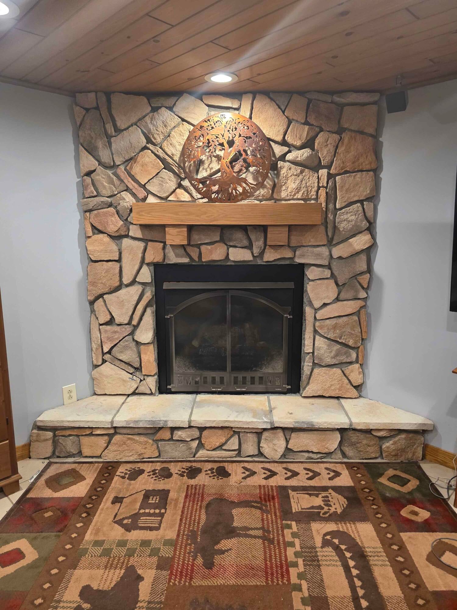 9367 Clewley Road Lachine, MI 49753 - Photo 13 of 23 fireplace in living room