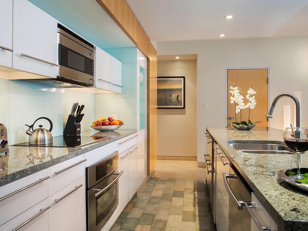 1401 Simonton Street, Unit 11 Key West, FL 33040 - Photo 3 of 17 a kitchen with stainless steel appliances granite countertop a sink and cabinets
