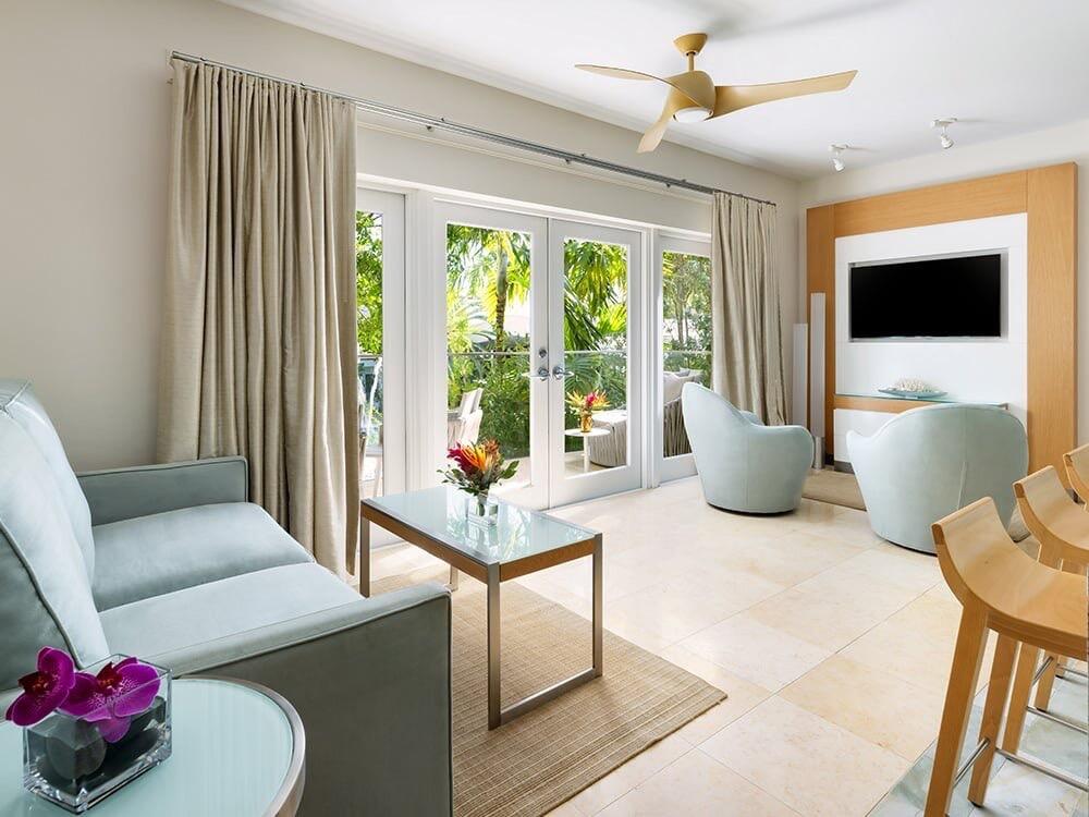 1401 Simonton Street, Unit 11 Key West, FL 33040 - Photo 4 of 17 a living room with furniture and a flat screen tv