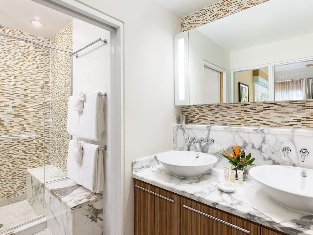 1401 Simonton Street, Unit 11 Key West, FL 33040 - Photo 7 of 17 a bathroom with a granite countertop sink and a mirror