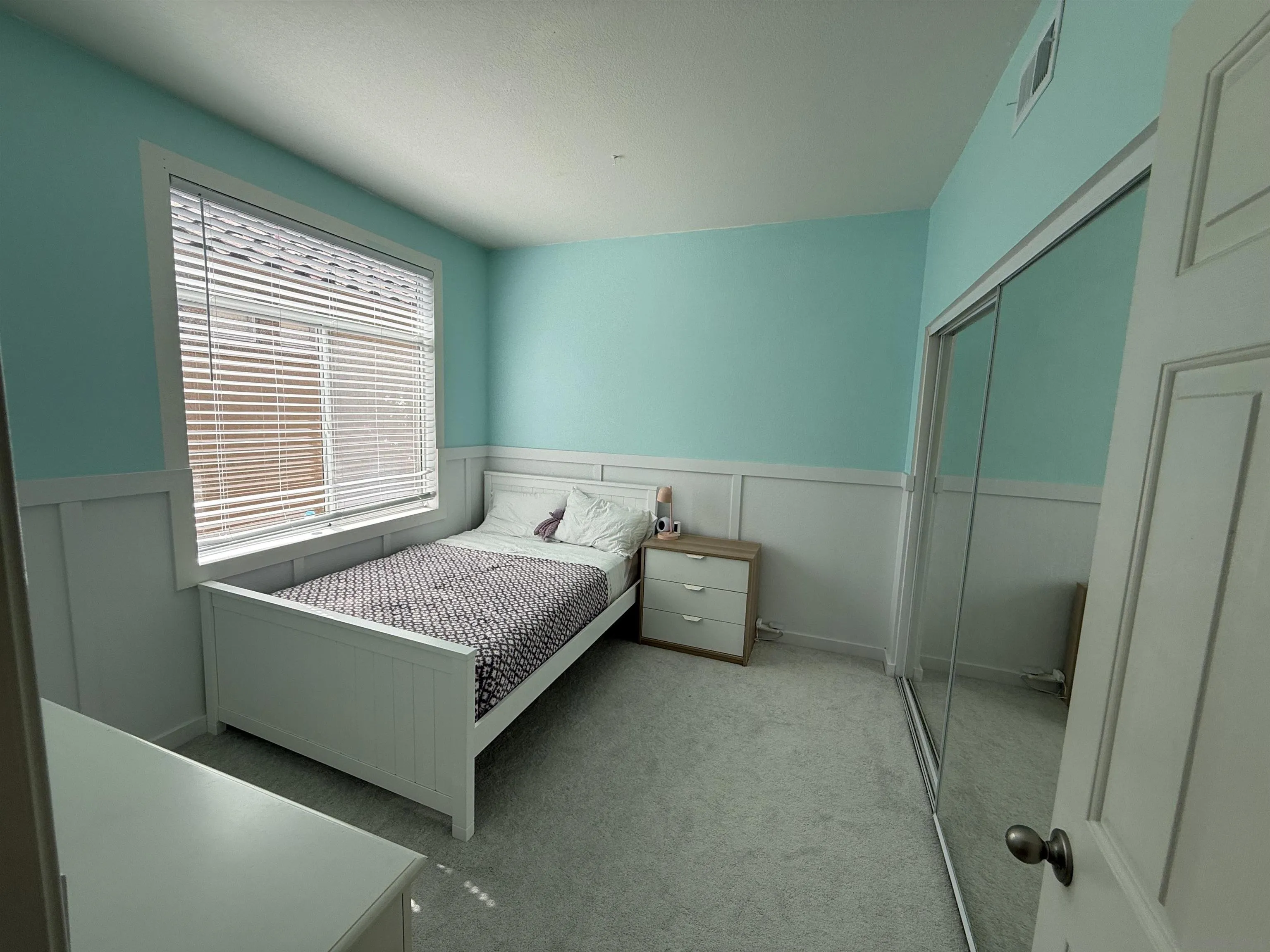 12530 Heatherton Court, Unit 31 San Diego, CA 92128 - Photo 11 of 36 a bedroom with a bed and a window