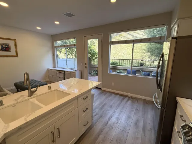 a living room with hard wood floors and a window