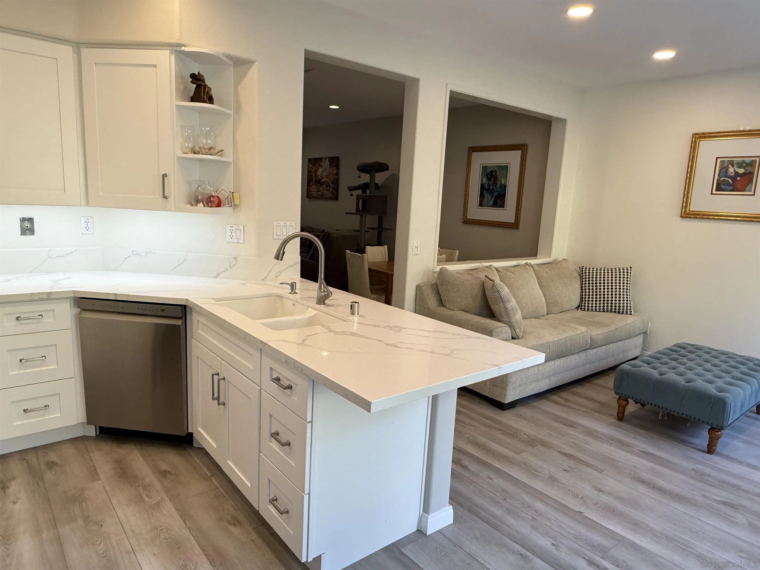 12530 Heatherton Court, Unit 31 San Diego, CA 92128 - Photo 20 of 36 a living room with a sink and a dresser