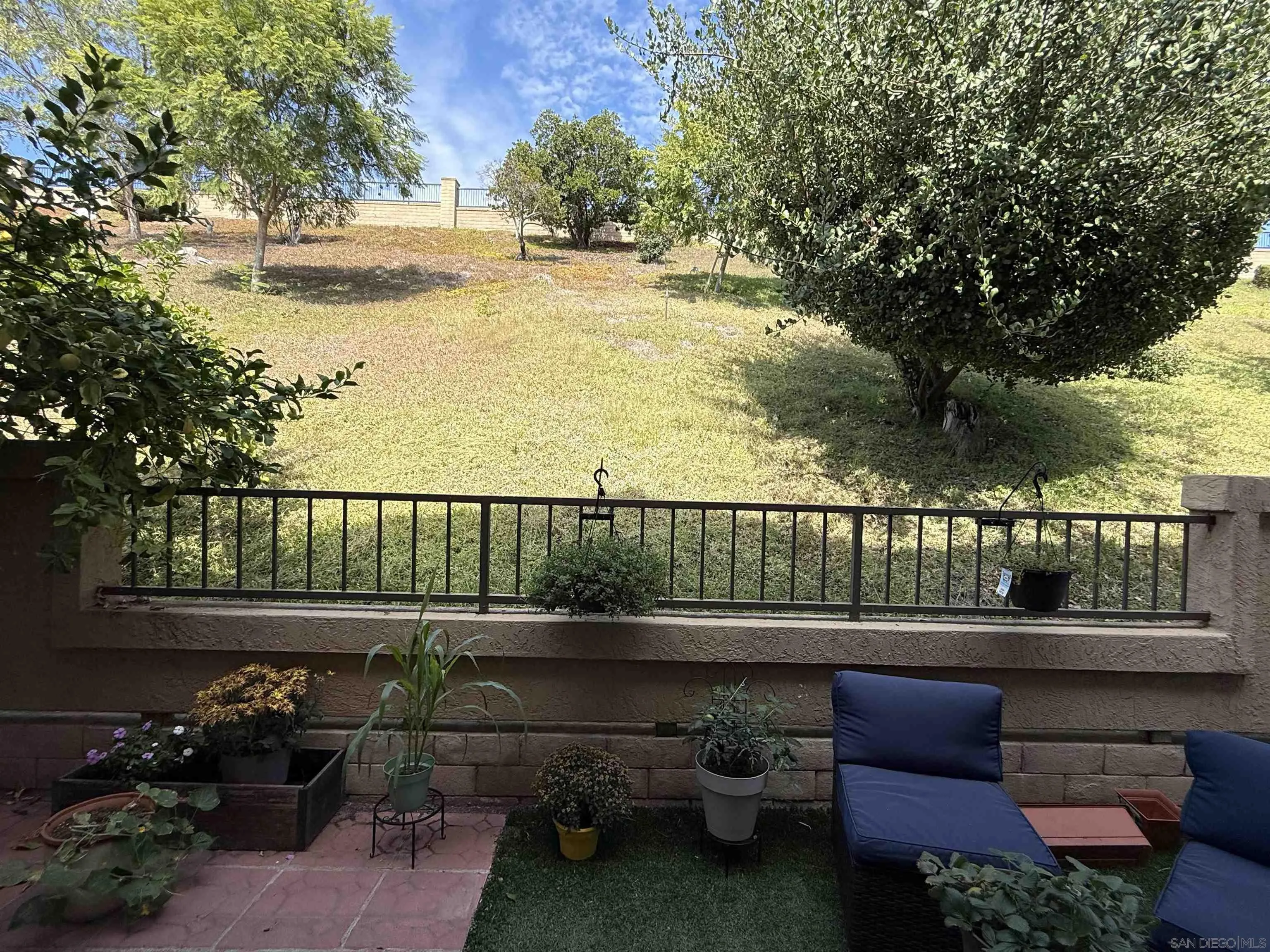 12530 Heatherton Court, Unit 31 San Diego, CA 92128 - Photo 26 of 36 a view of a chairs and table in patio