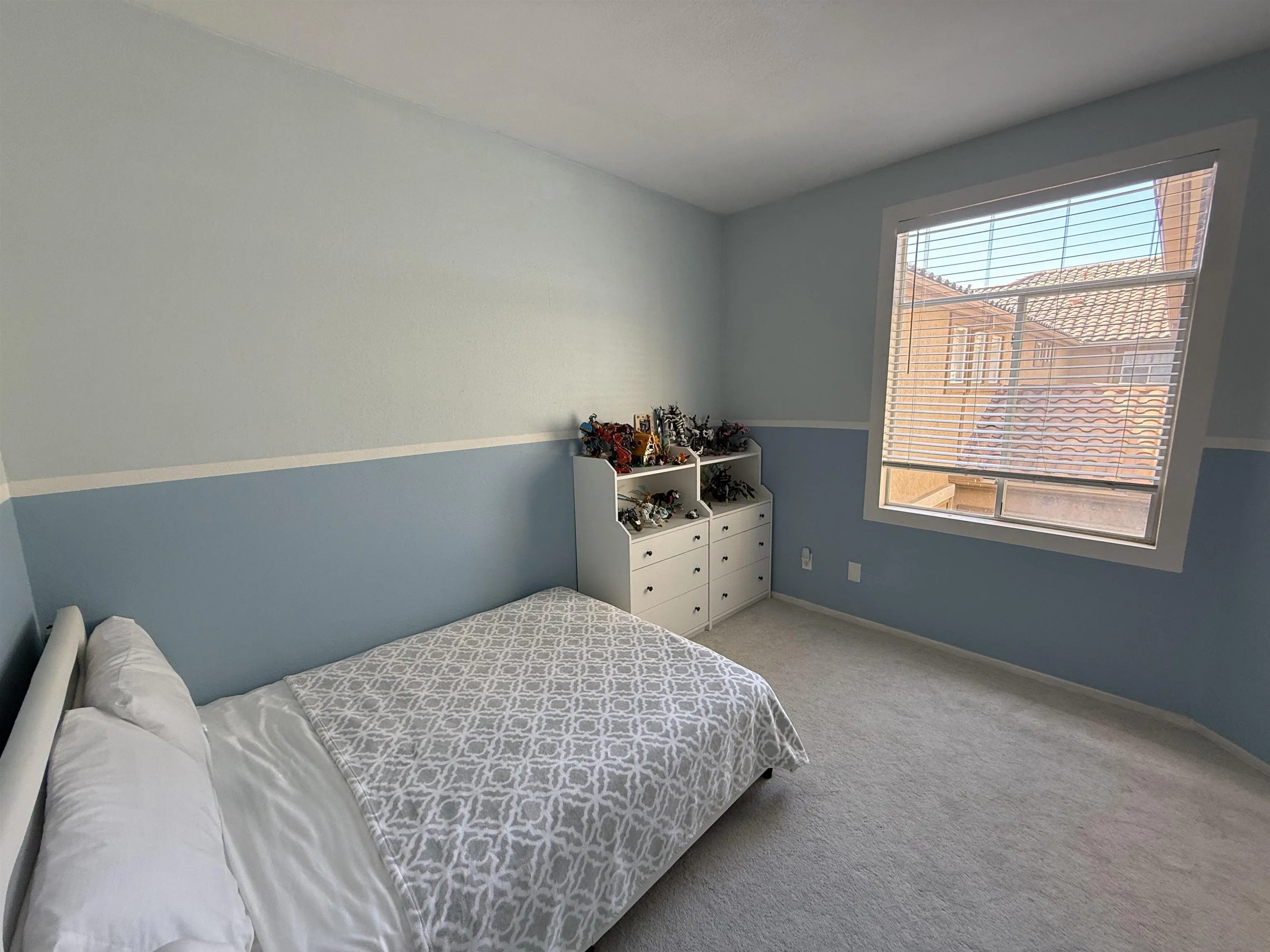 12530 Heatherton Court, Unit 31 San Diego, CA 92128 - Photo 10 of 36 a bedroom with a bed and a window