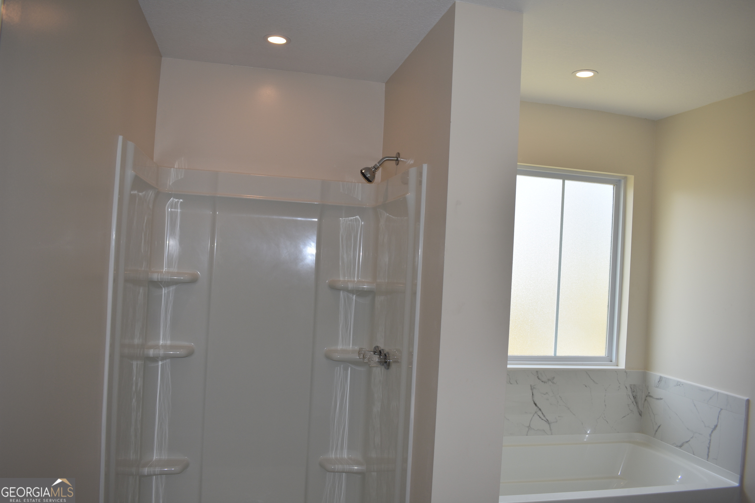 537 Quick Run Road Reidsville, GA 30453 - Photo 13 of 42 a bathroom with a bathtub and shower