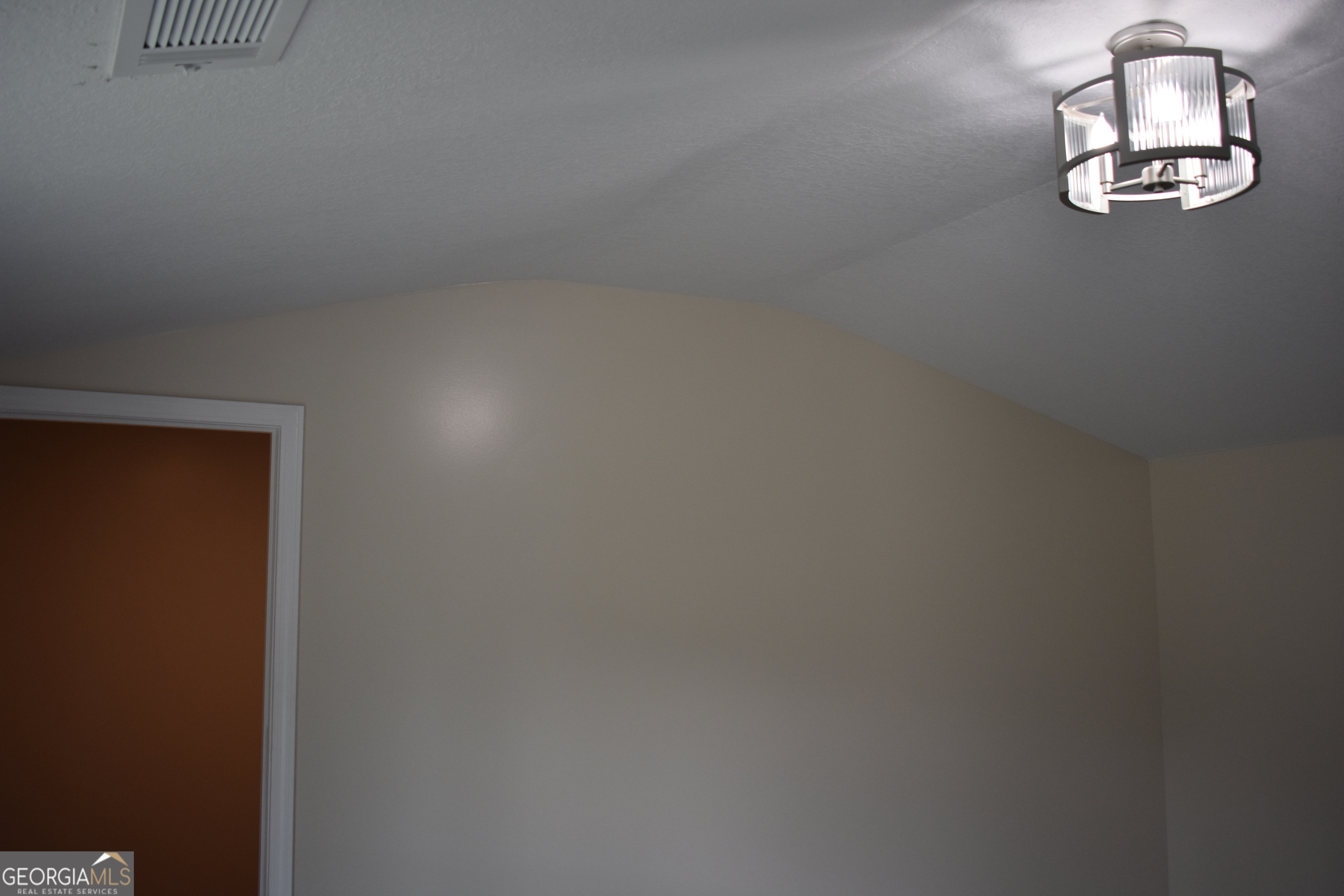 537 Quick Run Road Reidsville, GA 30453 - Photo 18 of 42 an empty room with a window