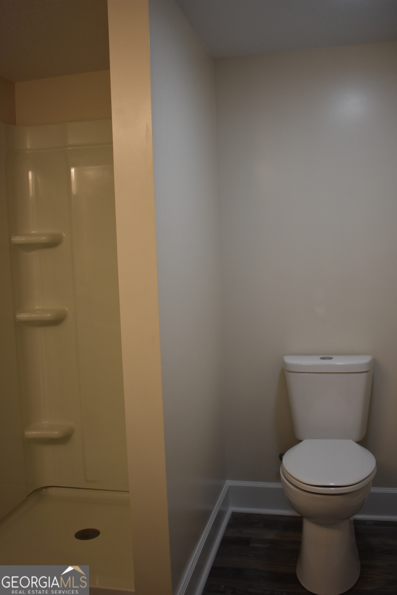 537 Quick Run Road Reidsville, GA 30453 - Photo 20 of 42 a bathroom with a toilet and a shower