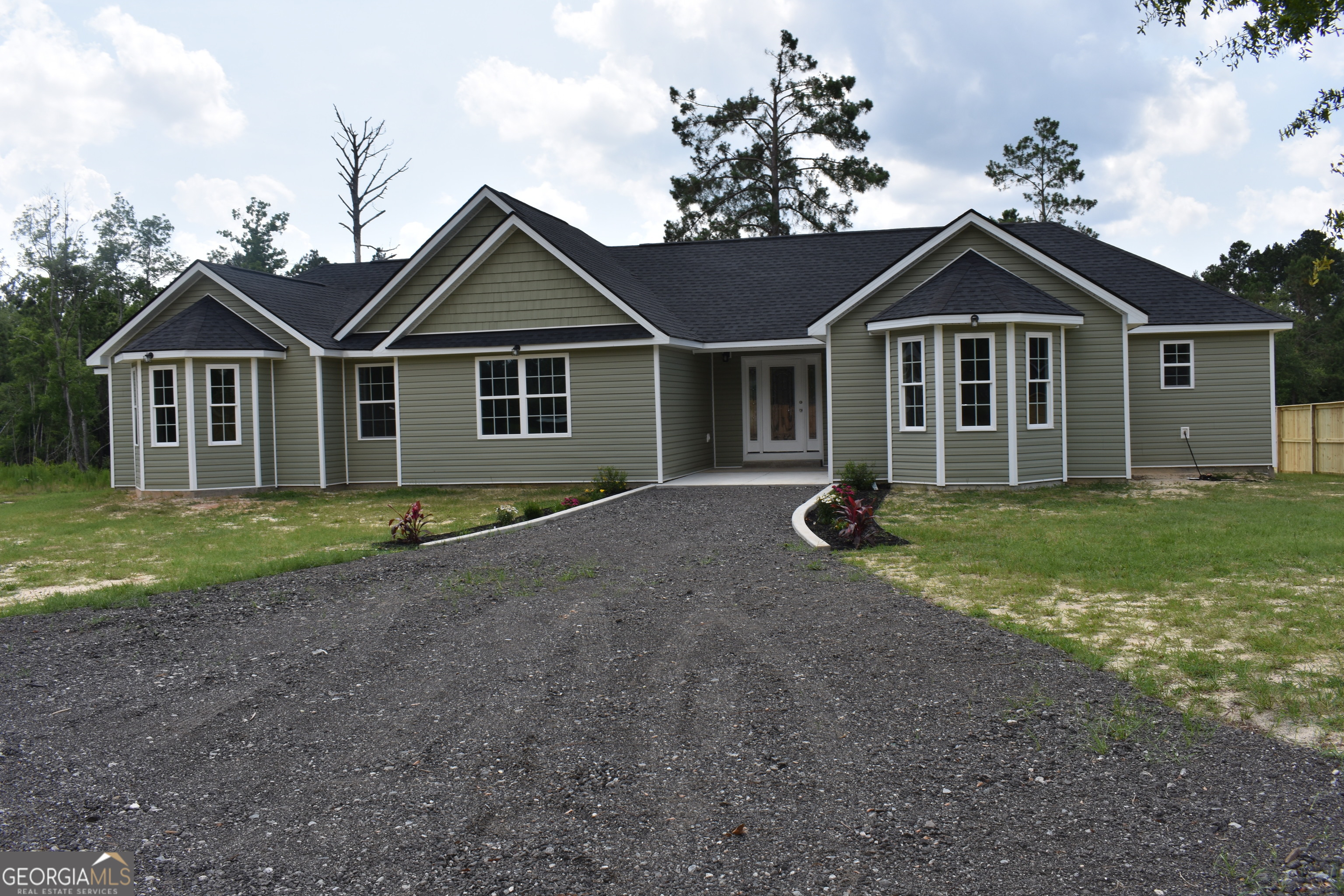 537 Quick Run Road Reidsville, GA 30453 - Photo 2 of 42 a view of a house with yard and a garden