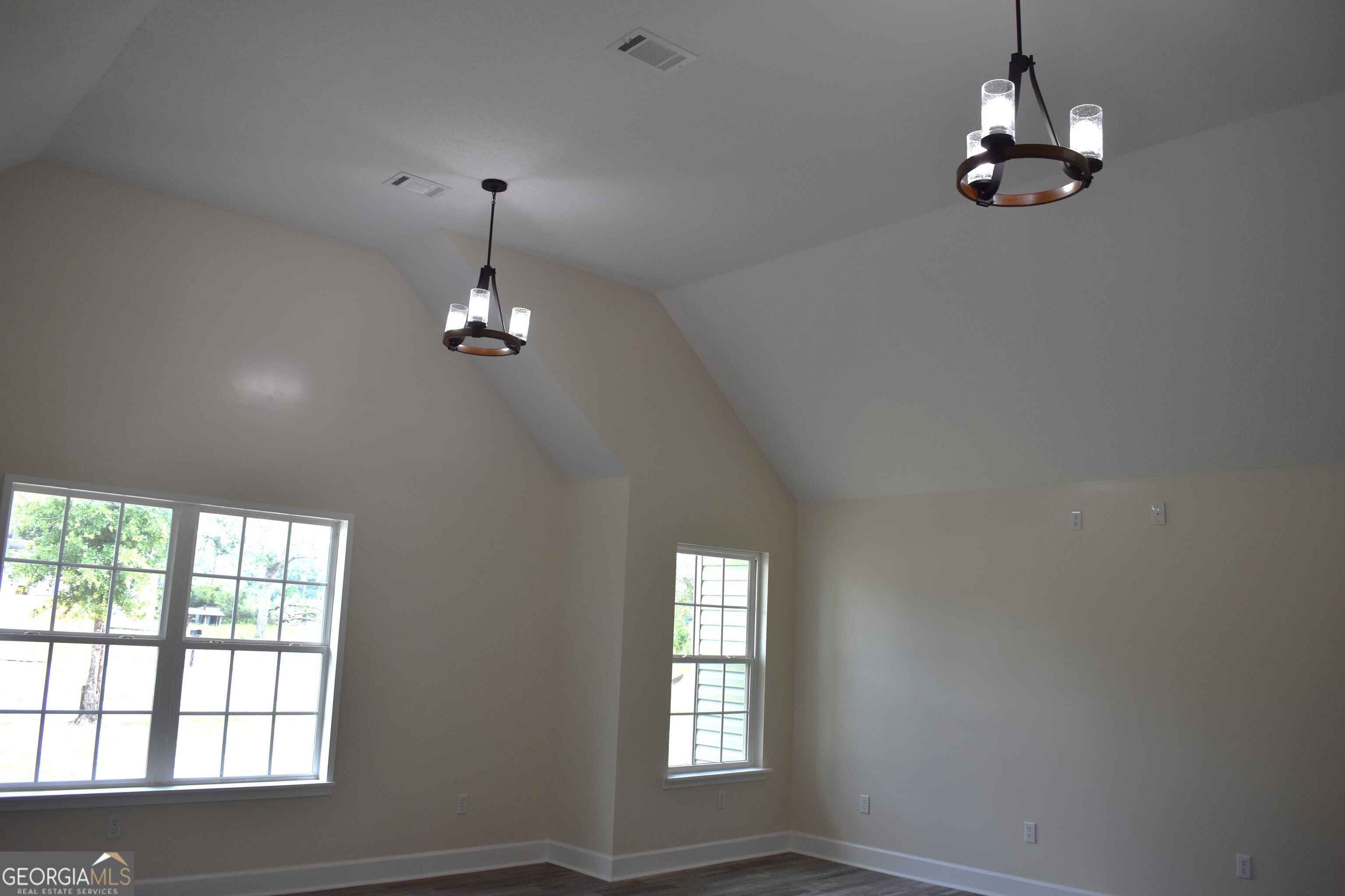 537 Quick Run Road Reidsville, GA 30453 - Photo 26 of 42 wooden floor in an empty room with a window