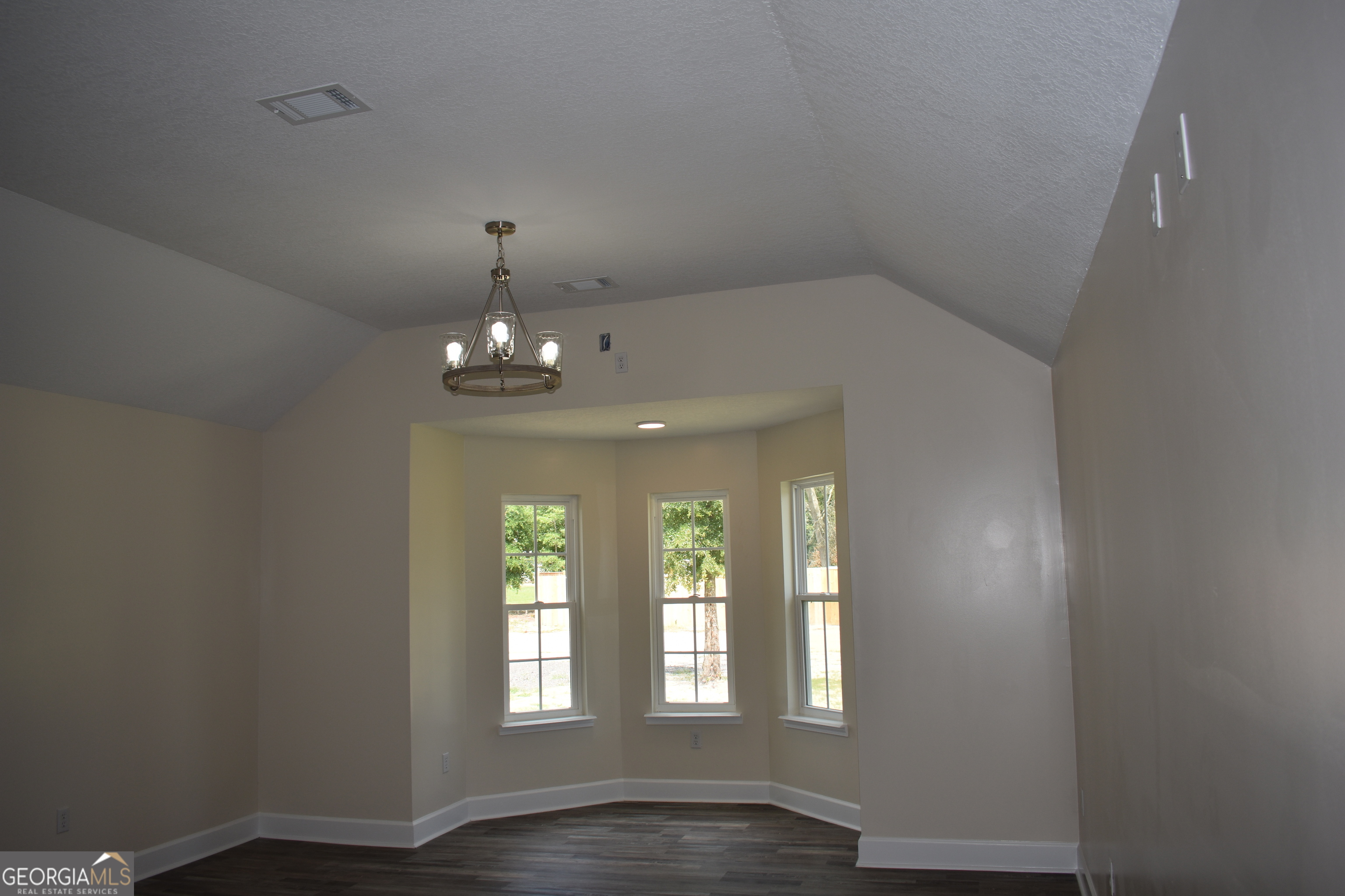 537 Quick Run Road Reidsville, GA 30453 - Photo 30 of 42 wooden floor in an empty room with a window