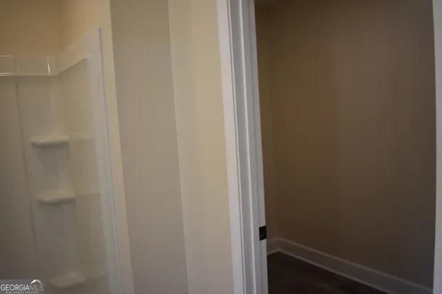 a bathroom with a shower and a toilet