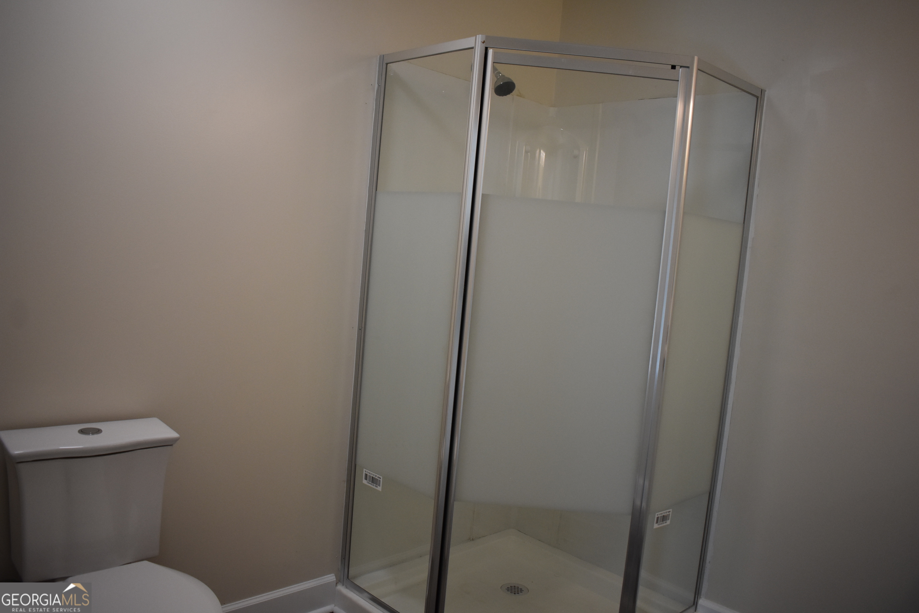 537 Quick Run Road Reidsville, GA 30453 - Photo 37 of 42 a bathroom with a shower and a toilet
