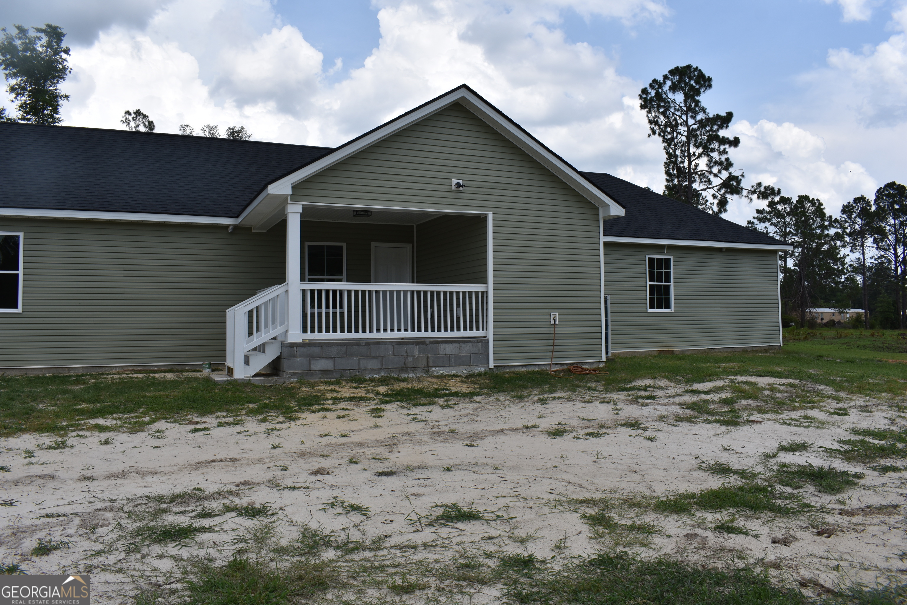 537 Quick Run Road Reidsville, GA 30453 - Photo 7 of 42 a view of a house with a yard
