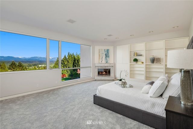 a living room with furniture fireplace and window