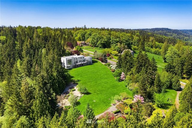 a aerial view of a house with a garden and yard
