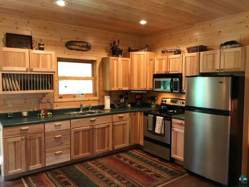 1094 Fernberg Road Ely, MN 55731 - Photo 3 of 12 Hickory cabinets and laminate flooring