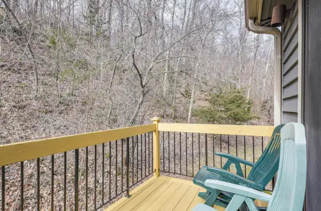 a view of a balcony with wooden floor