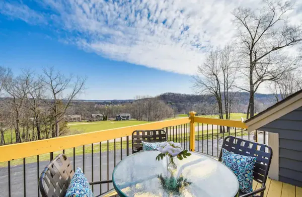 a view of balcony with furniture
