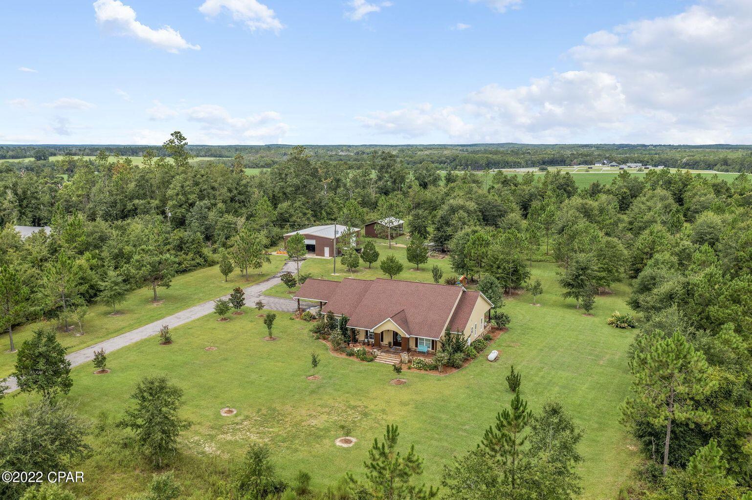 1428 Piney Grove Road Chipley, FL 32428 - Photo 3 of 58 a view of a lake with outdoor space