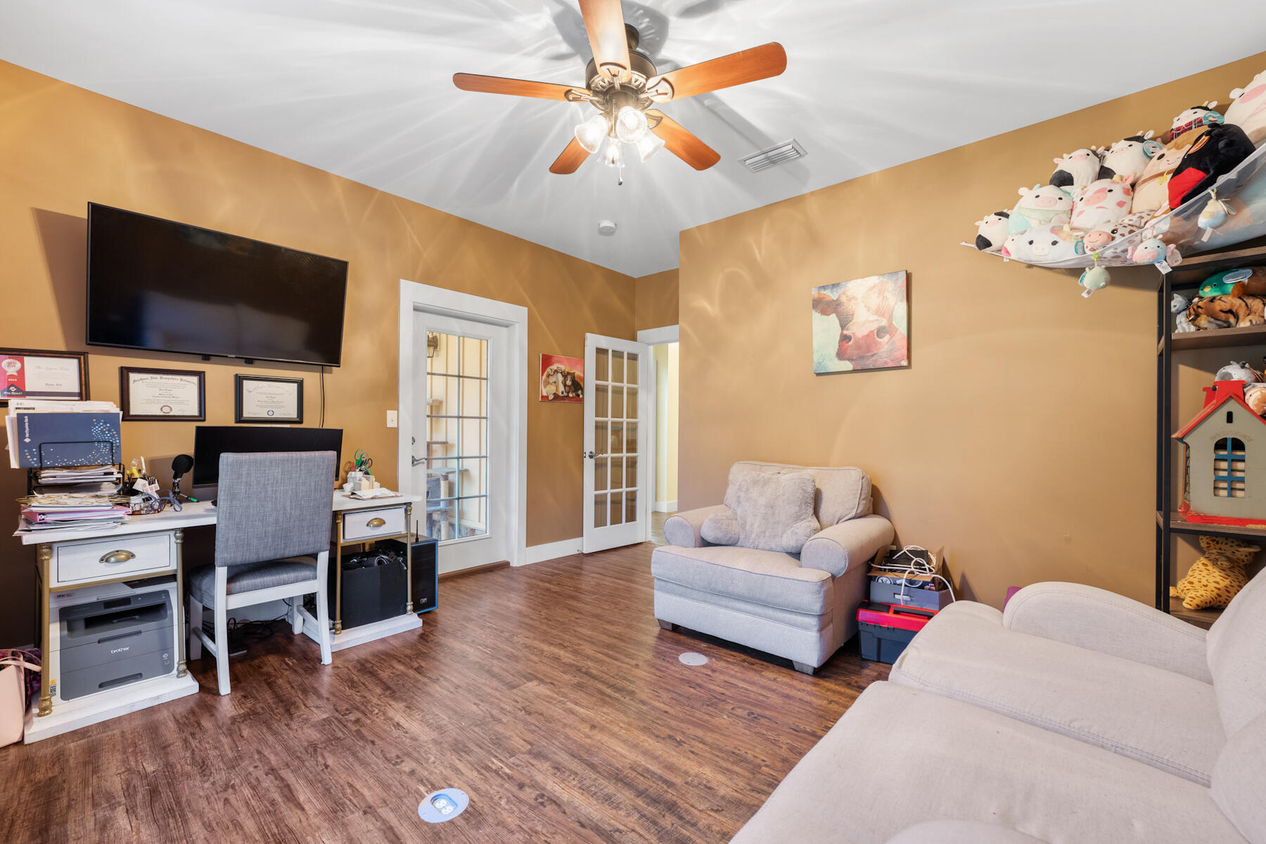 1428 Piney Grove Road Chipley, FL 32428 - Photo 34 of 58 a living room with furniture and a wooden floor