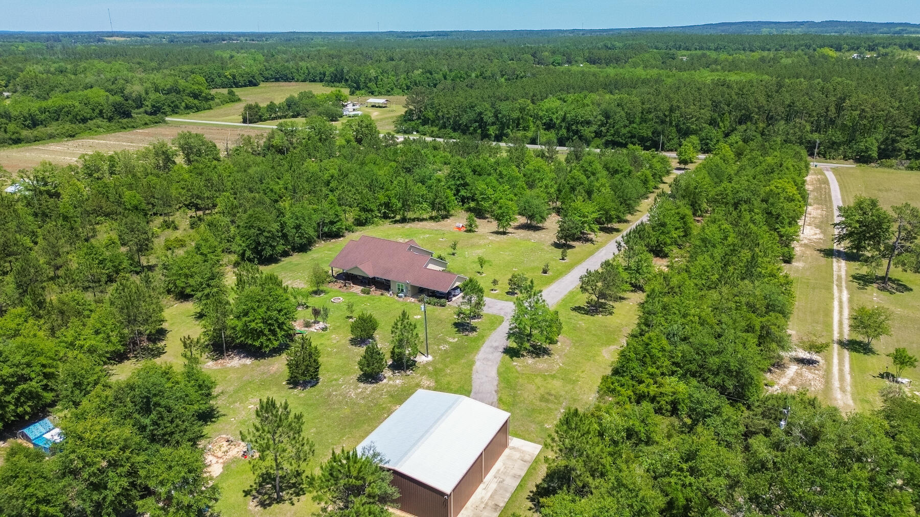 1428 Piney Grove Road Chipley, FL 32428 - Photo 54 of 58 an aerial view of residential house with outdoor space and street view