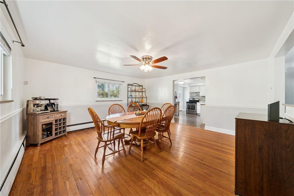 3454 Rigel Street Pittsburgh, PA 15212 - Photo 13 of 37 a dining room with furniture and wooden floor