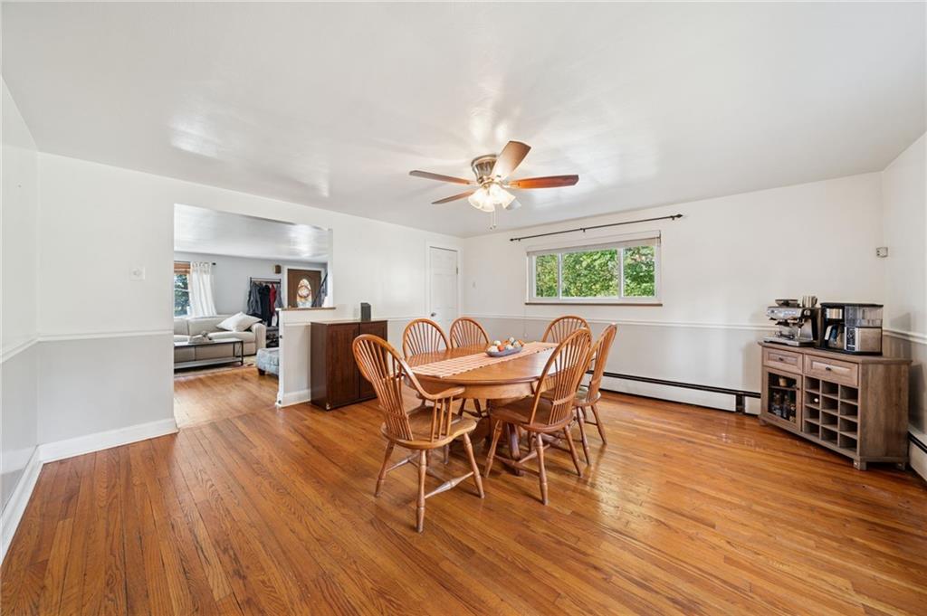 3454 Rigel Street Pittsburgh, PA 15212 - Photo 14 of 37 a view of a dining room with furniture window and wooden floor